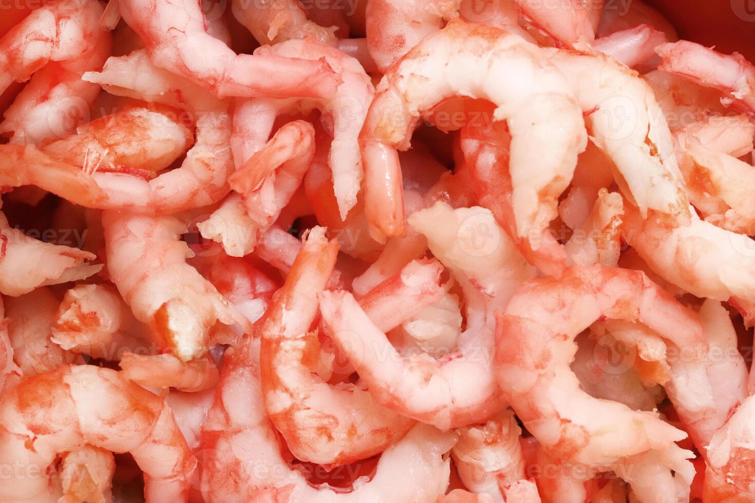 Prawns snack filling background. Boiled peeled shrimps meat texture. photo