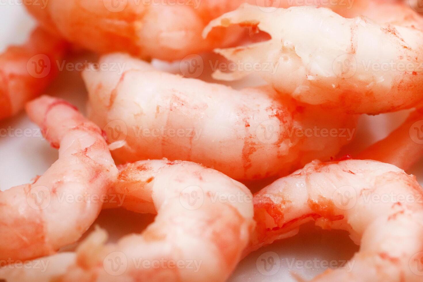Boiled peeled shrimps texture. Prawns filling background. Macro closeup. photo