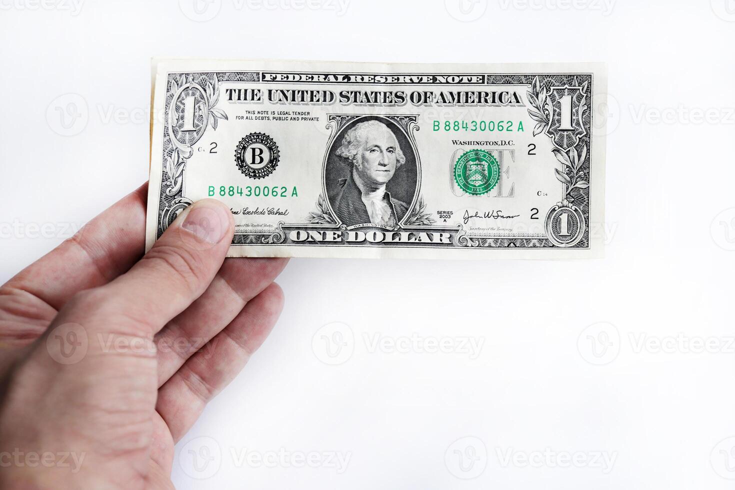 In hand dollars money stack. Isolated United States of America dollars banknotes. photo