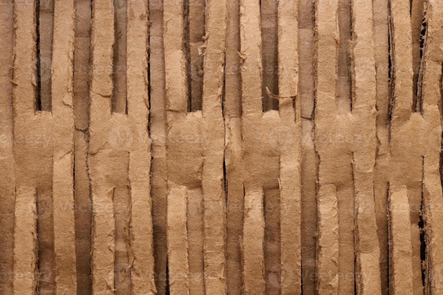Ribbed carton texture. Fluted paper backdrop. Corrugated cardboard filling background. photo