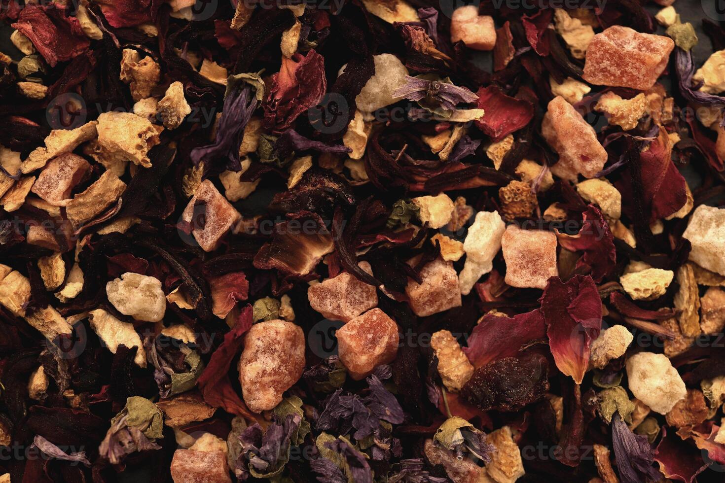 Scattered tea pattern. Many dry flowers background. Lot of dry red petals texture. photo
