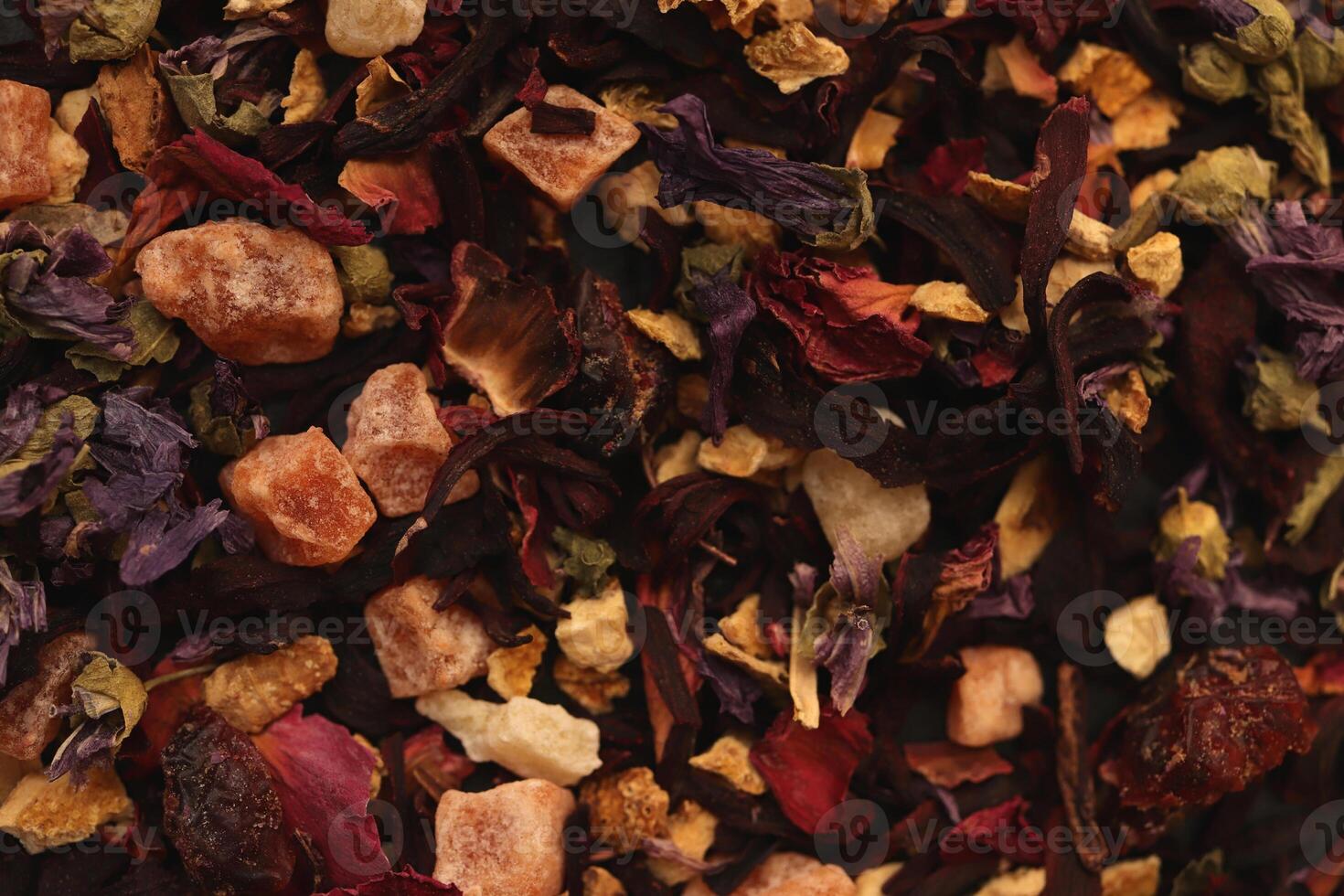 Many dry flowers background. Lot of dry red petals texture. Scattered tea pattern. photo
