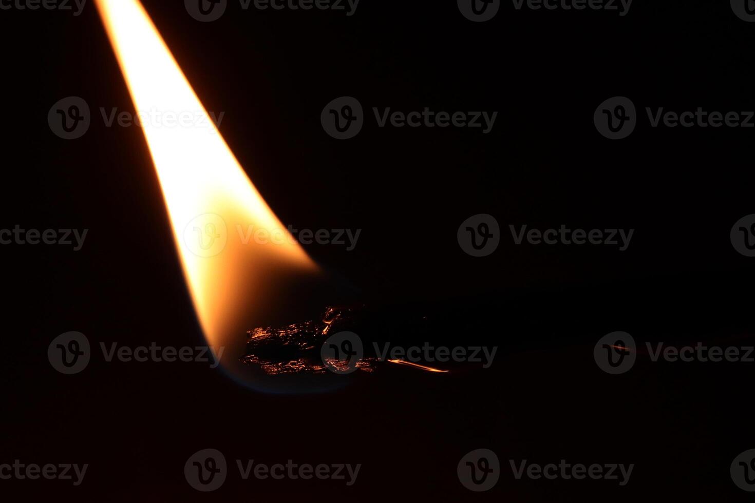 Fire on a stick. Blaze fire texture. Glowing burl light. photo