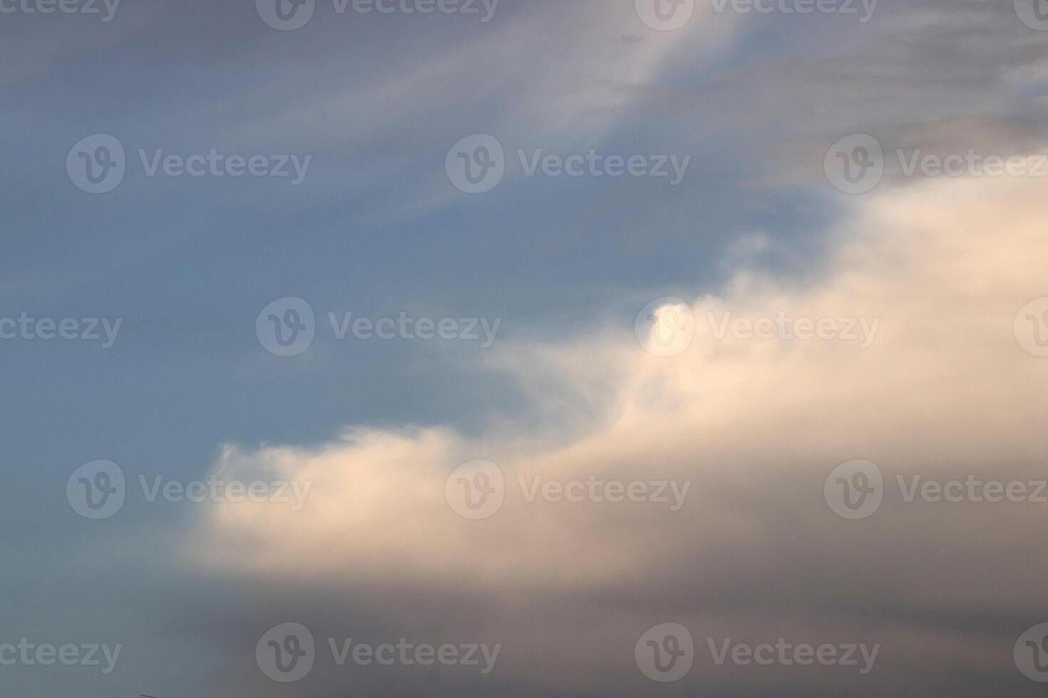Cloudscape altocumulus lenticularis blue sky sunlight texture. photo