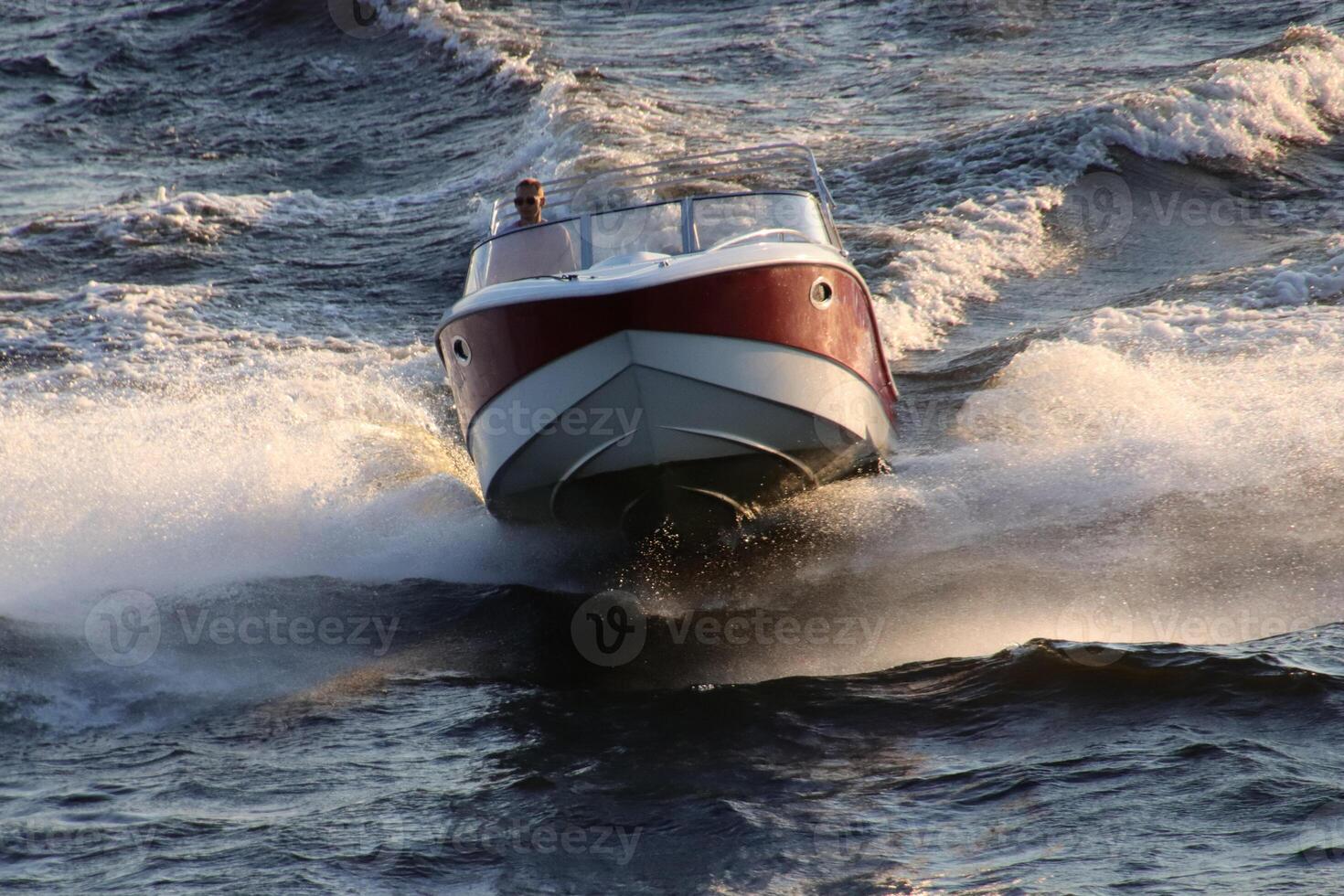 A powerful boat crosses the waters of the Neva River photo