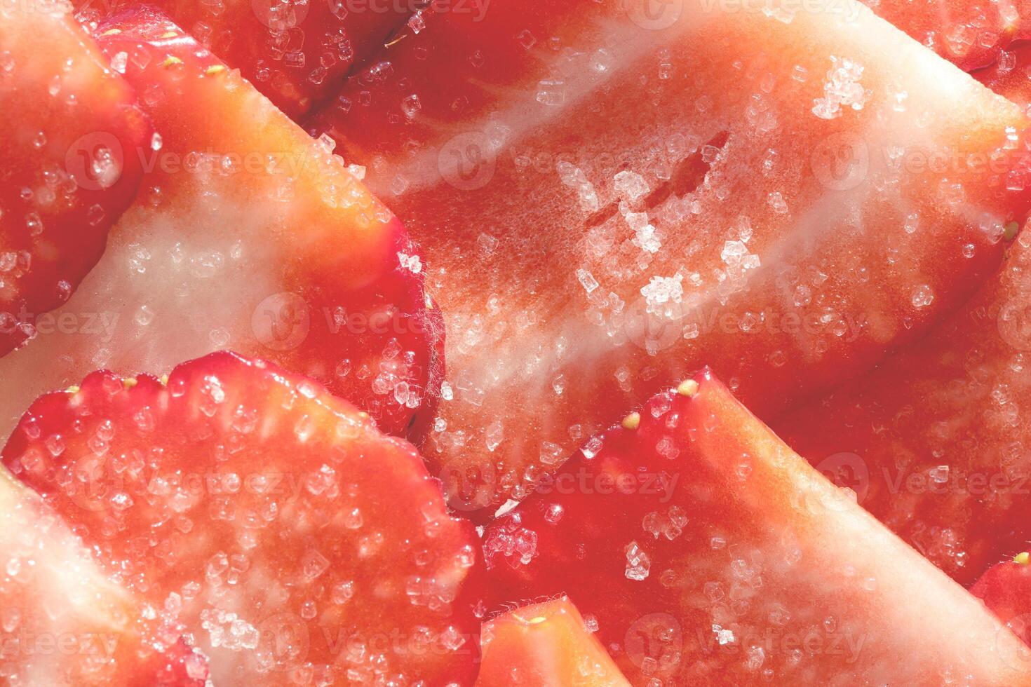 Strawberry with sugar texture. Vitamin berry backdrop. Strawberry slices in sugar filling background. photo