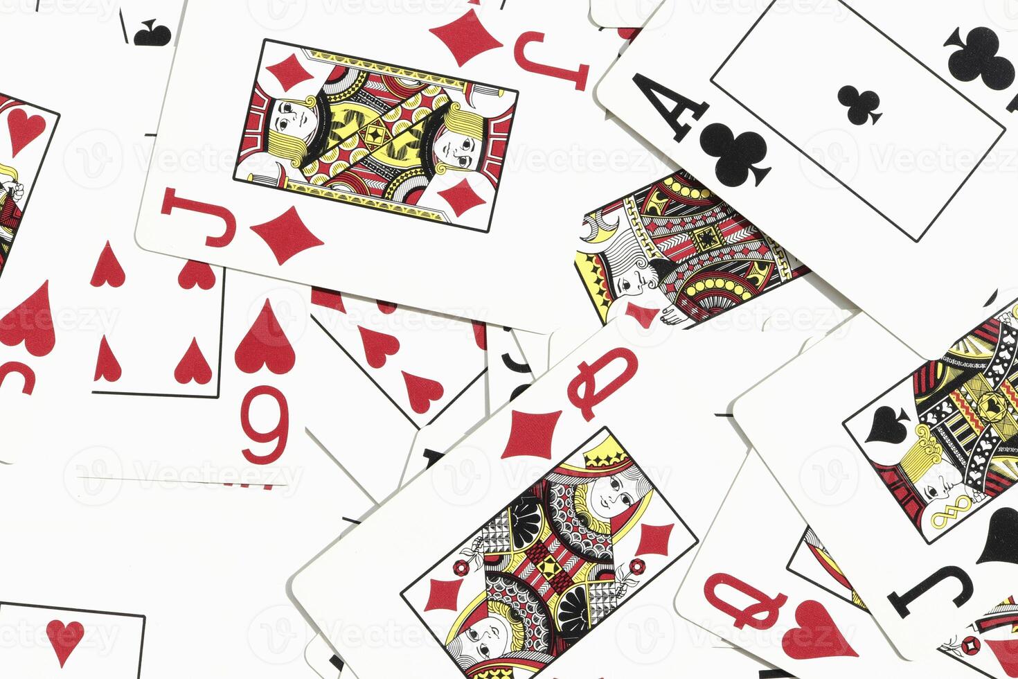 Mixed playing cards background. Assorted play cards backdrop. Many miscellaneous jumbled playing cards surface. photo