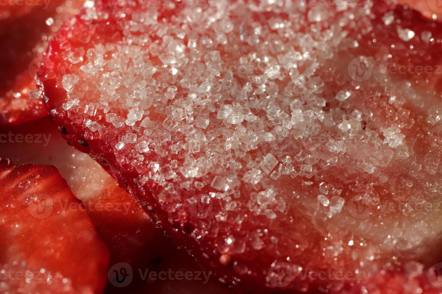 Strawberry slice with sugar. Sweet Berry background. Tasty delicious background. photo