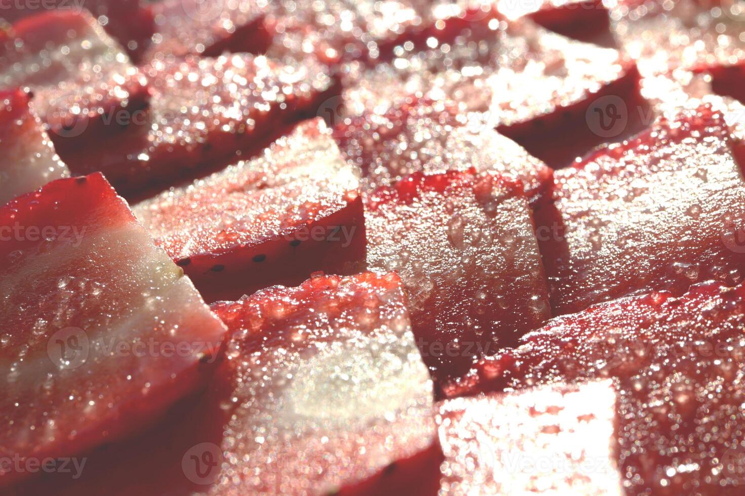 Strawberry with sugar texture. Vitamin berry backdrop. Strawberry slices in sugar filling background. photo