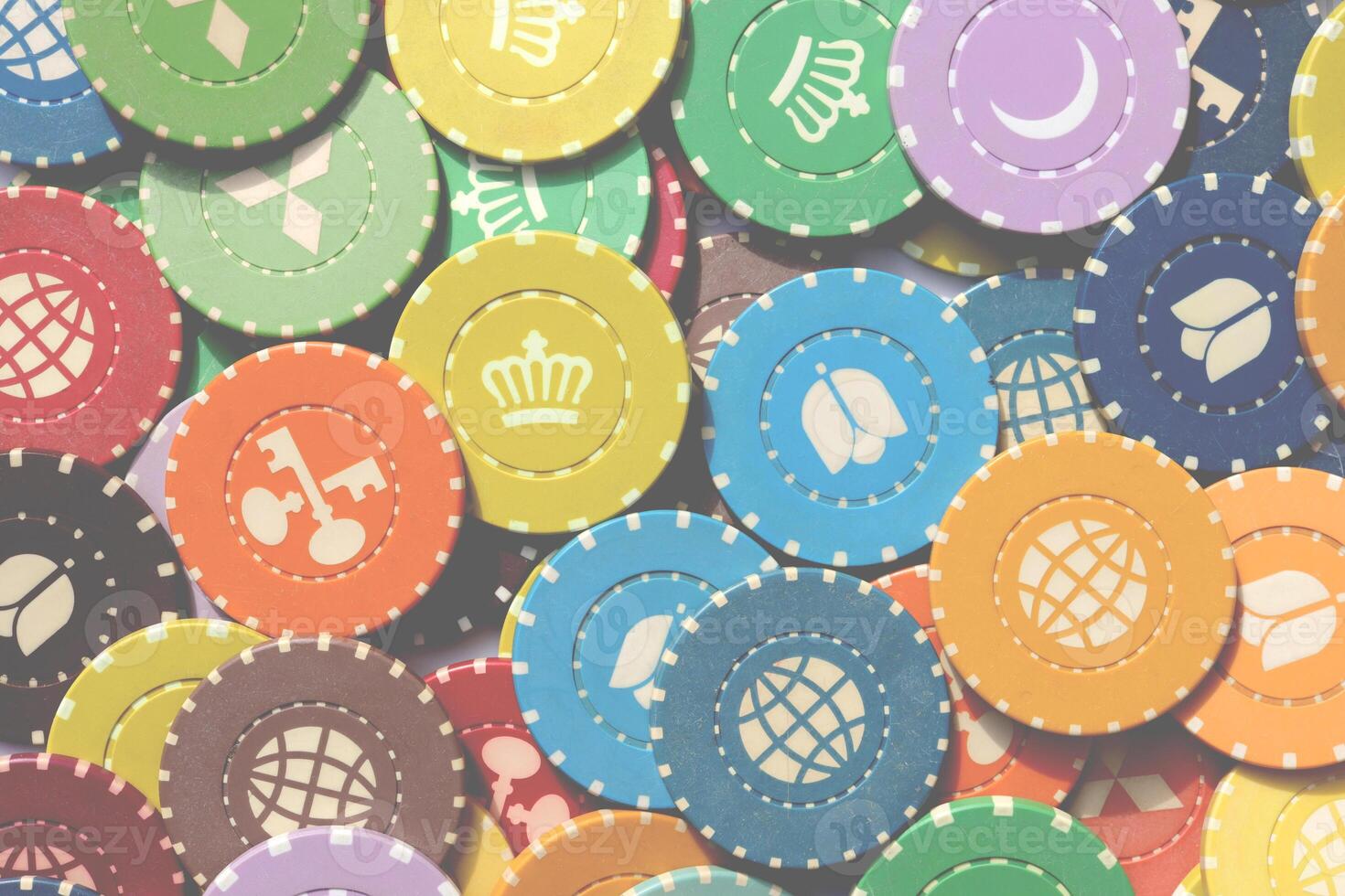Colorful casino chips background. Many colored chips backdrop. Lot multicolor assorted gambling playing chips surface. photo