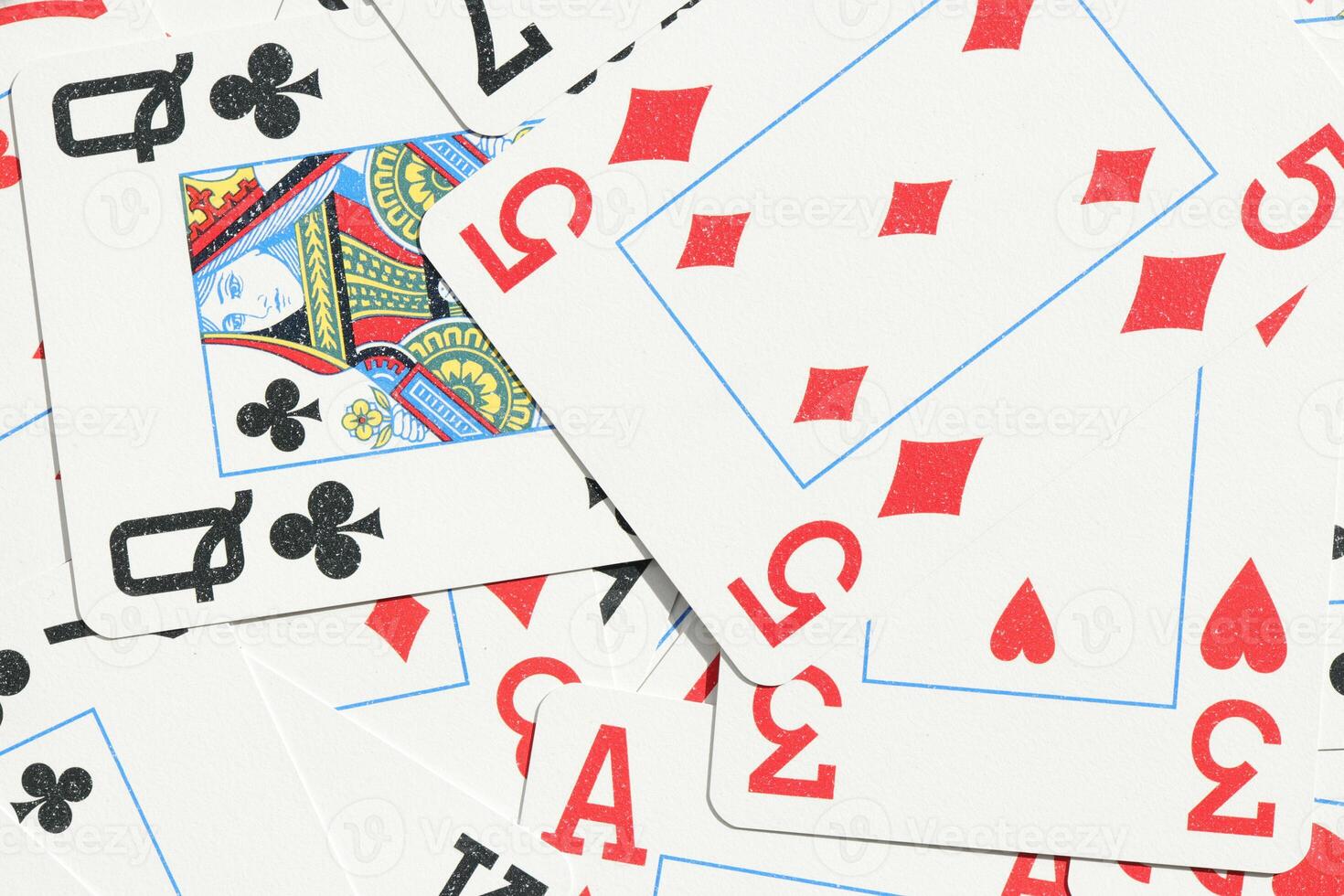 Mixed playing cards background. Assorted play cards backdrop. Many miscellaneous jumbled playing cards surface. photo