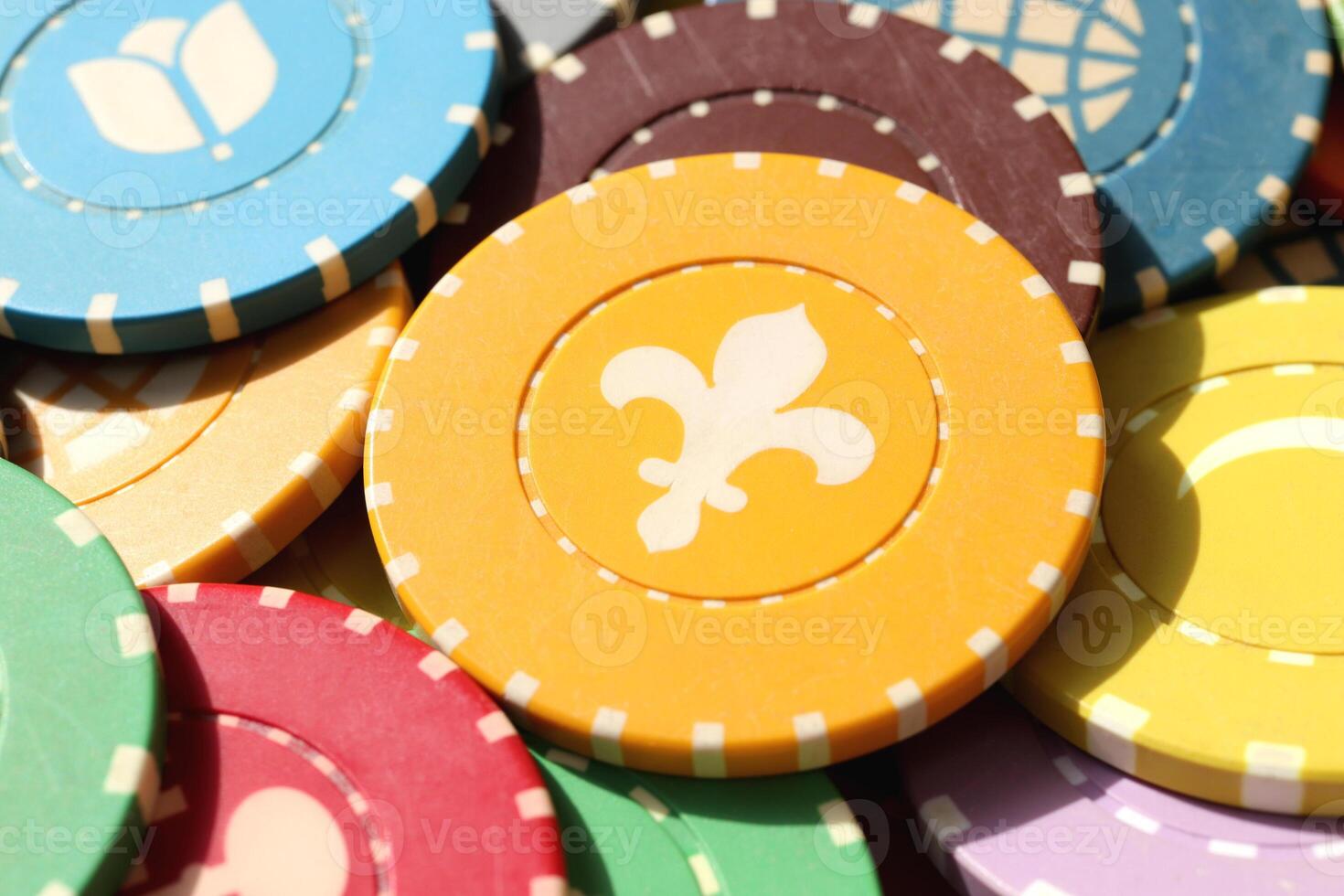 Colorful casino chips background. Many colored chips backdrop. Lot multicolor assorted gambling playing chips surface. photo