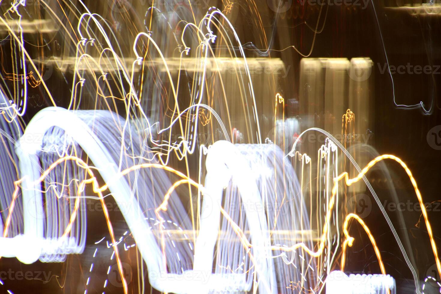 Night city rays glow background. Night exposure zoom traces backdrop. Light lines leaks exposition texture. photo
