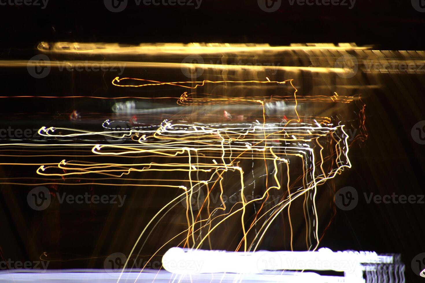 Night city rays glow background. Night exposure zoom traces backdrop. Light lines leaks exposition texture. photo
