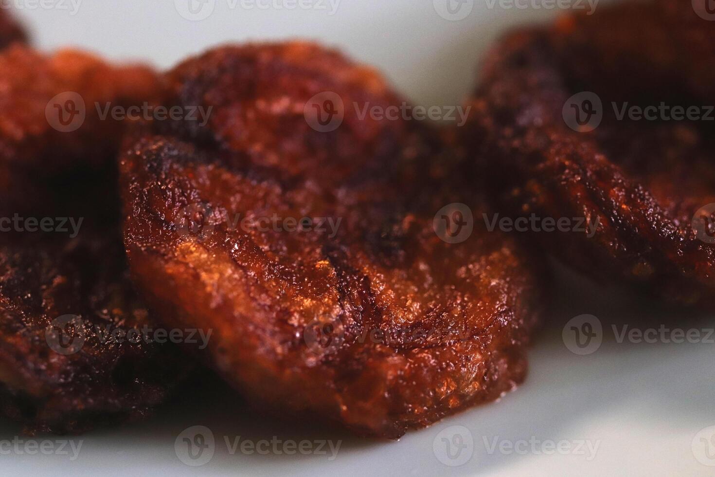 Slices pieces of fried banana. Healthy organic food backdrop. Natural tasty snack. photo