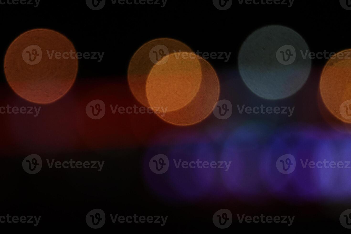 Blurred colored lights background. Lens bokeh backdrop. Flare color lights overlays. Abstract bright blurred colored bokeh. photo