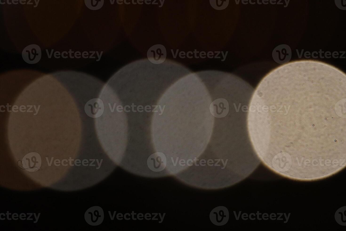 Blurred colored lights background. Lens bokeh backdrop. Flare color lights overlays. Abstract bright blurred colored bokeh. photo