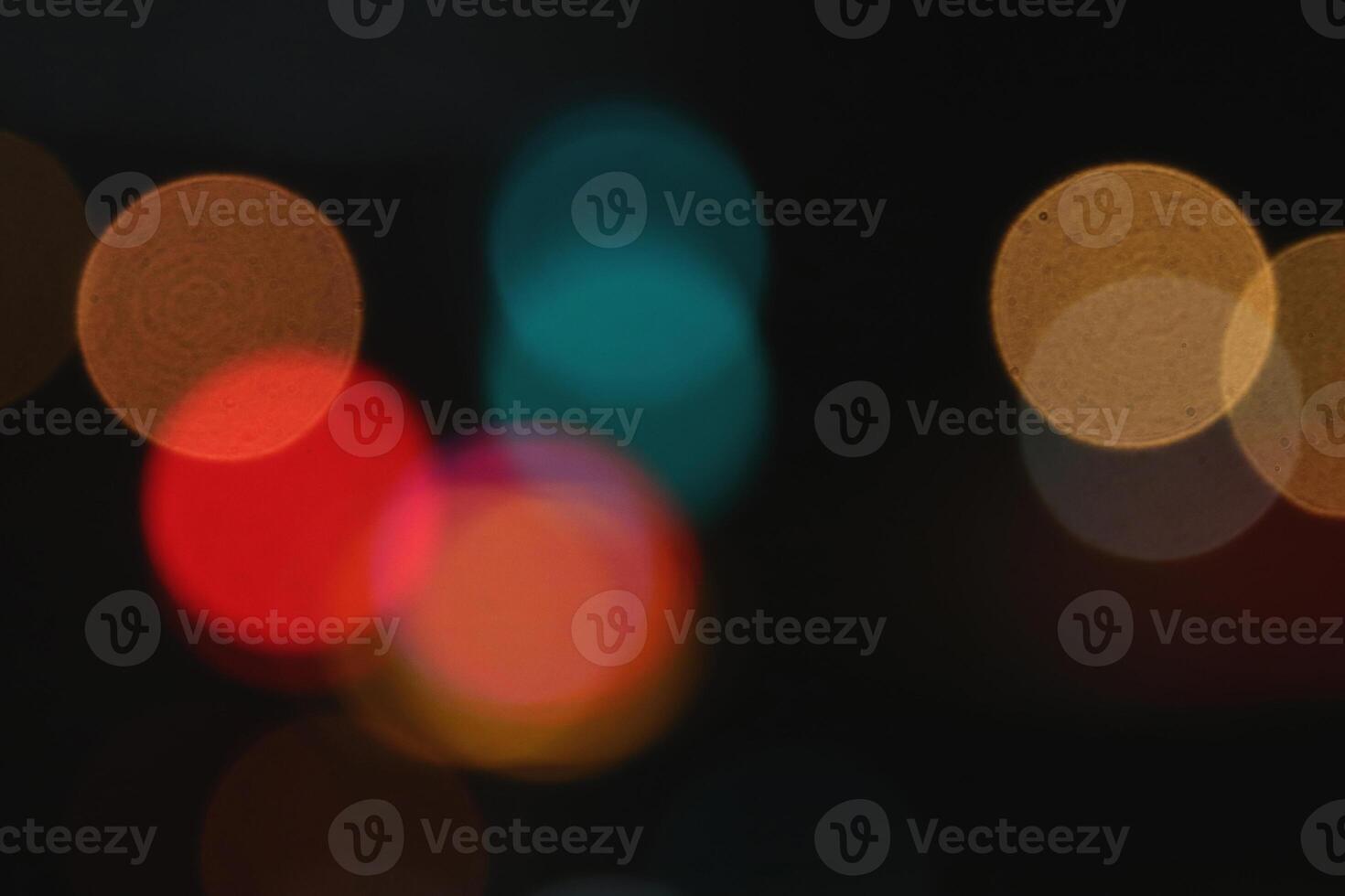 Blurred colored lights background. Lens bokeh backdrop. Flare color lights overlays. Abstract bright blurred colored bokeh. photo