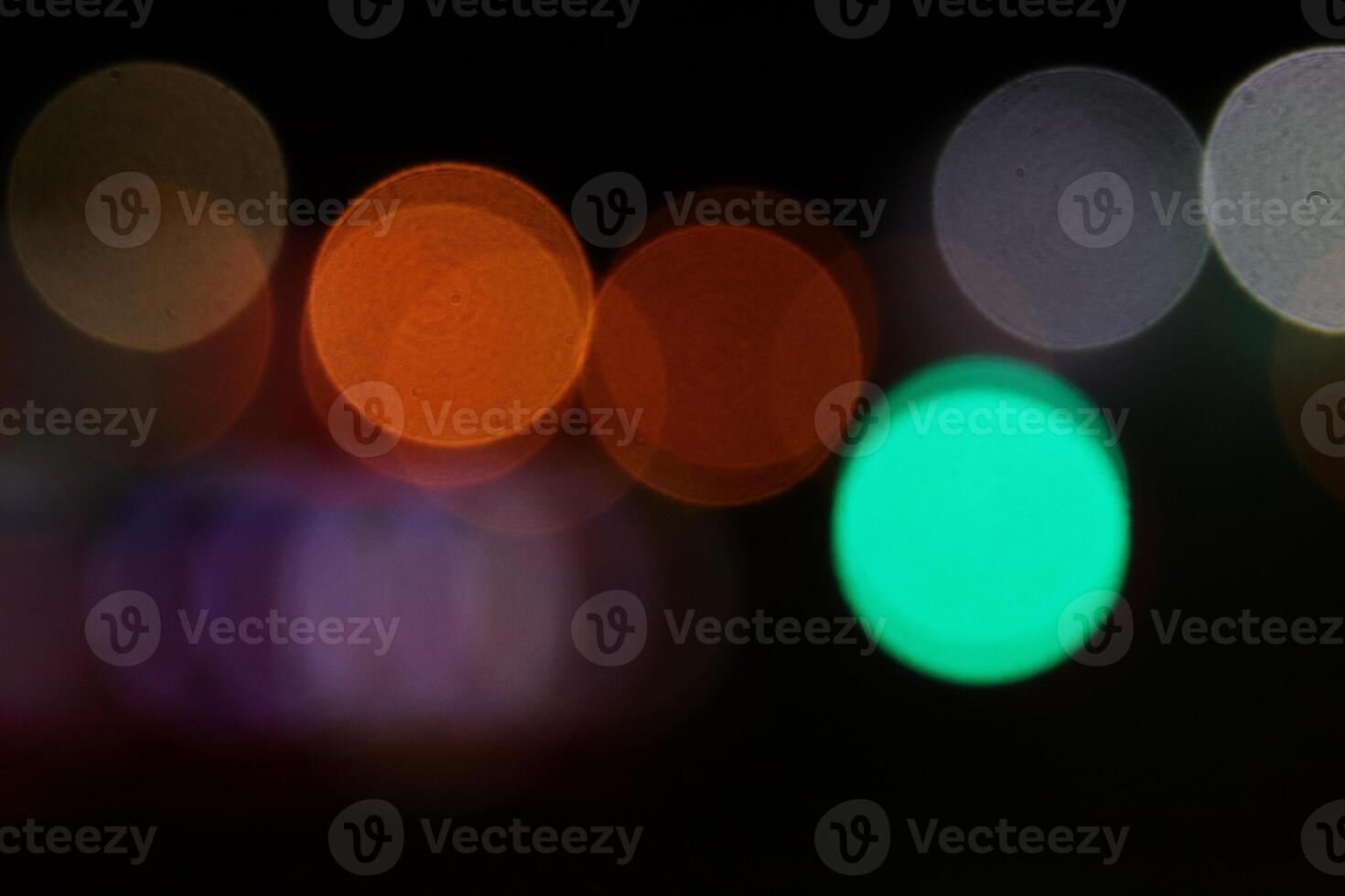 Abstract bright blurred colored bokeh. Blurred colored lights background. Lens bokeh backdrop. Flare color lights overlays. photo