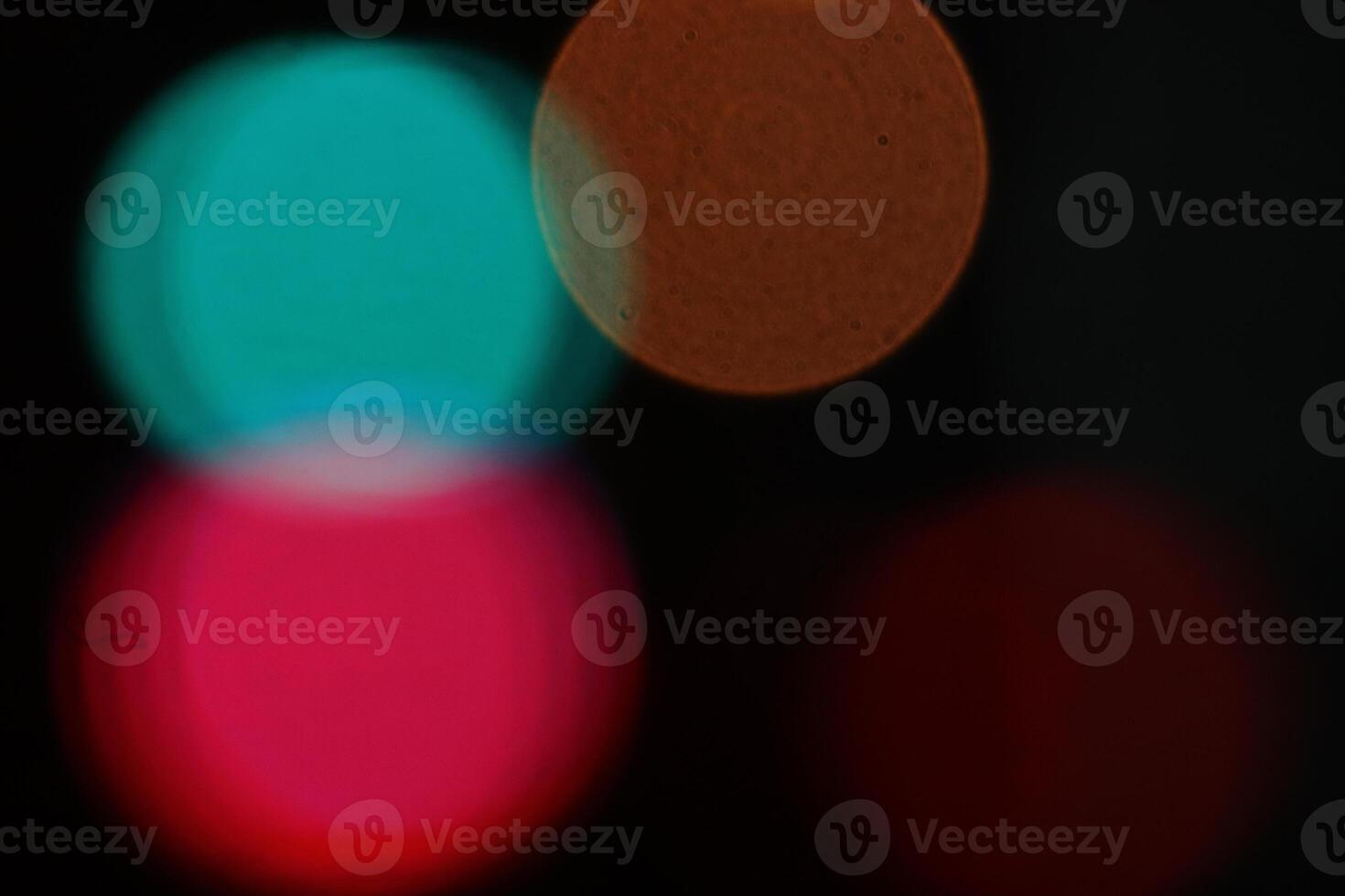 Abstract bright blurred colored bokeh. Blurred colored lights background. Lens bokeh backdrop. Flare color lights overlays. photo