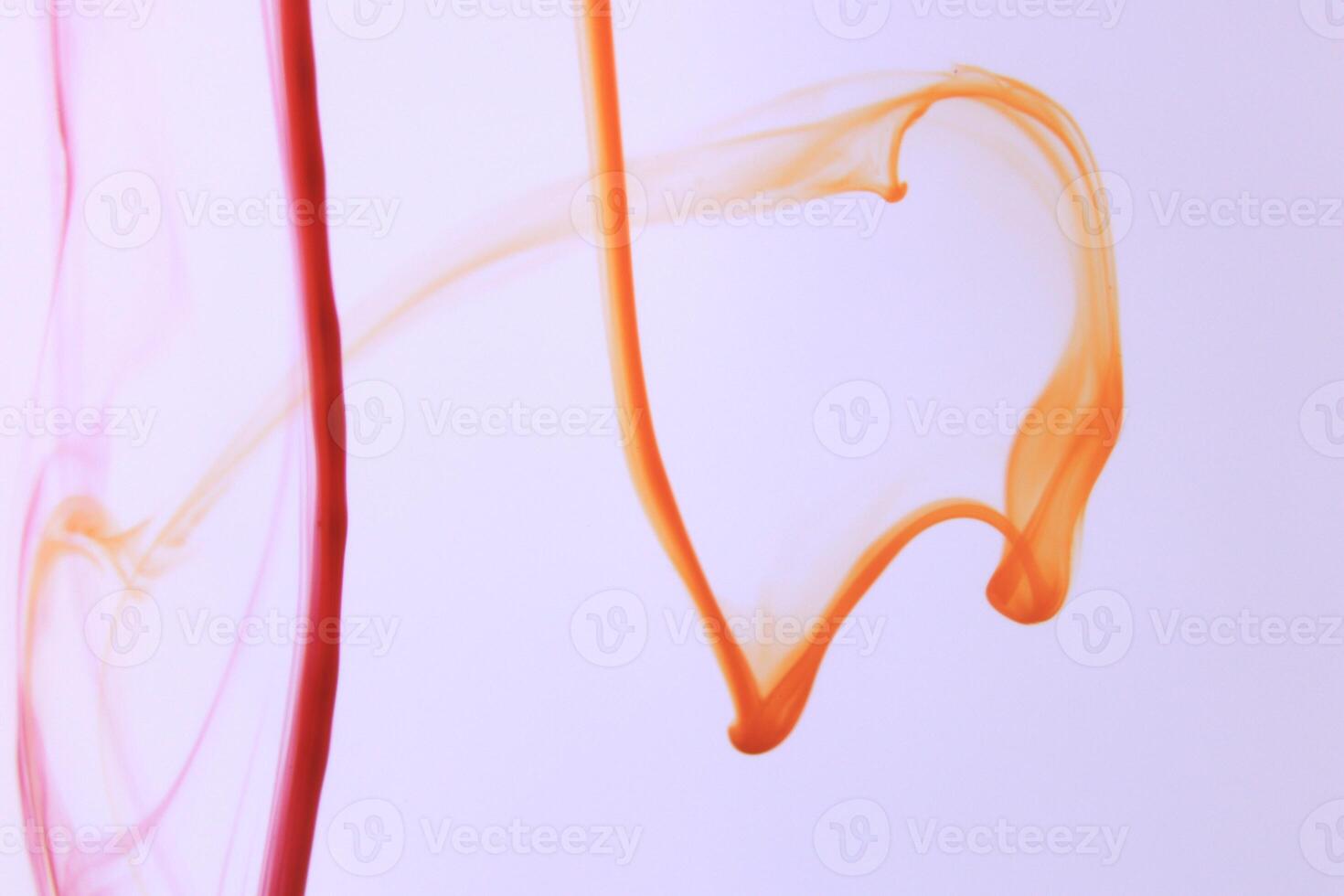 Red Orange Ink Lines in Water photo
