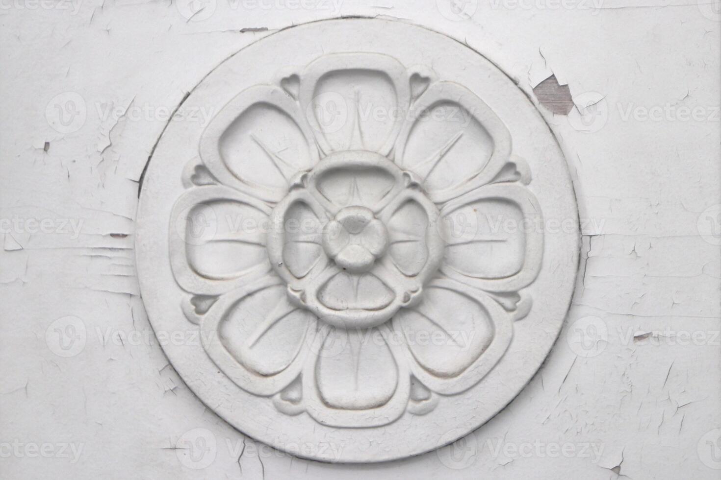 Flower stucco molding on the door. Vintage floral pattern. photo