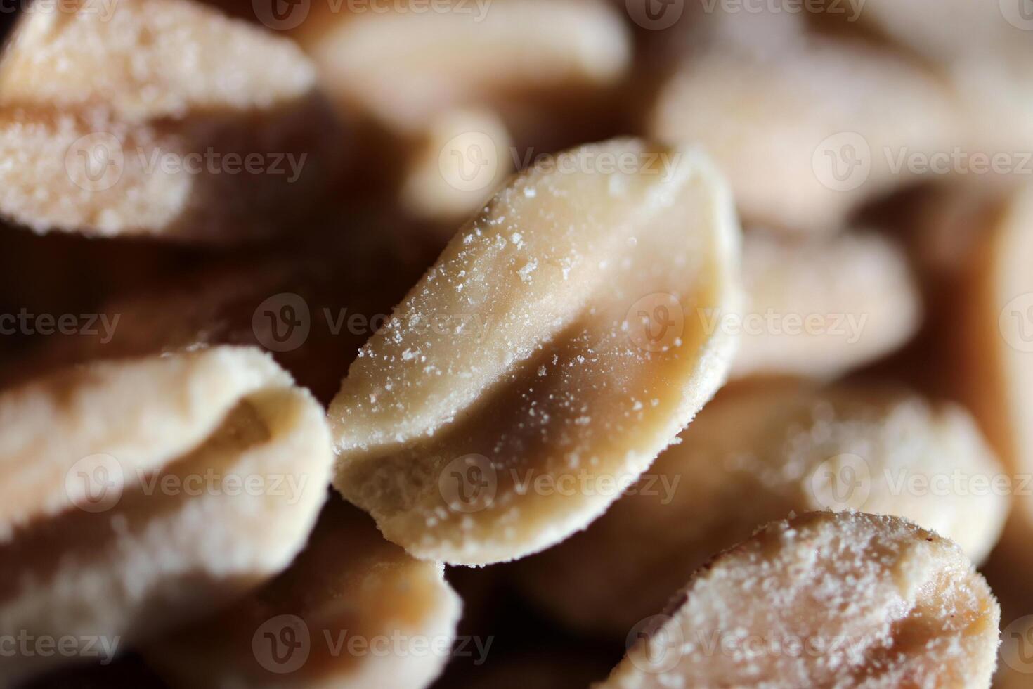 A handful of salted peanuts background. Macro closeup. photo