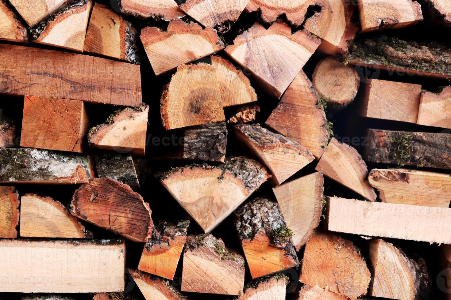 Timber butts stack texture. Lumber planks pile background. Wooden logging backdrop. photo