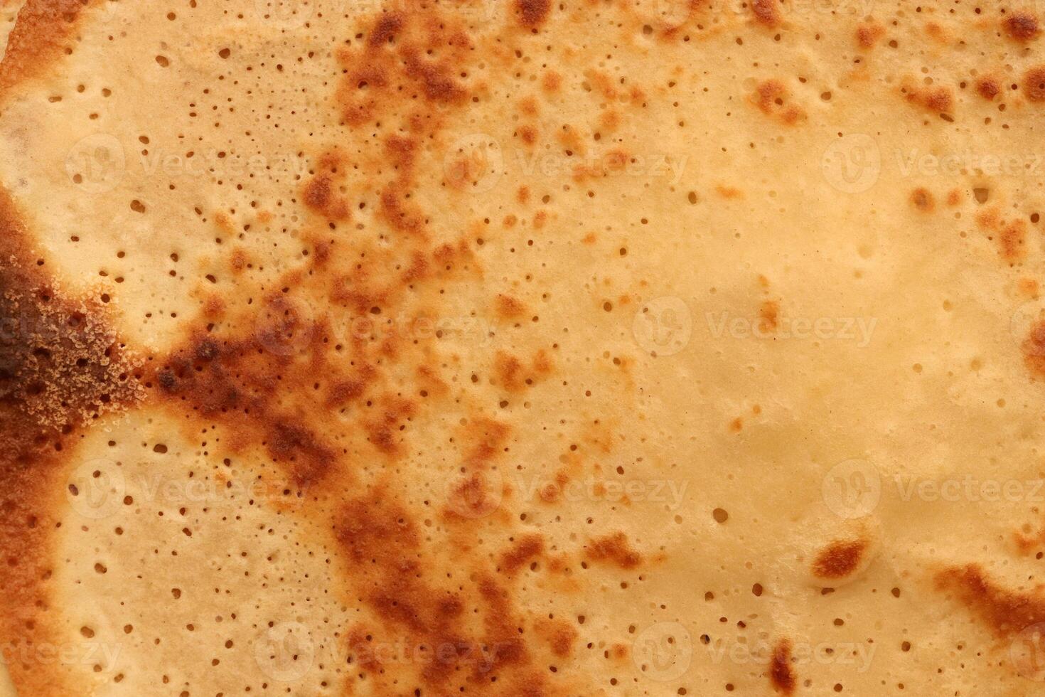 Toasted homemade pancake delicious backdrop texture. Macro closeup. photo