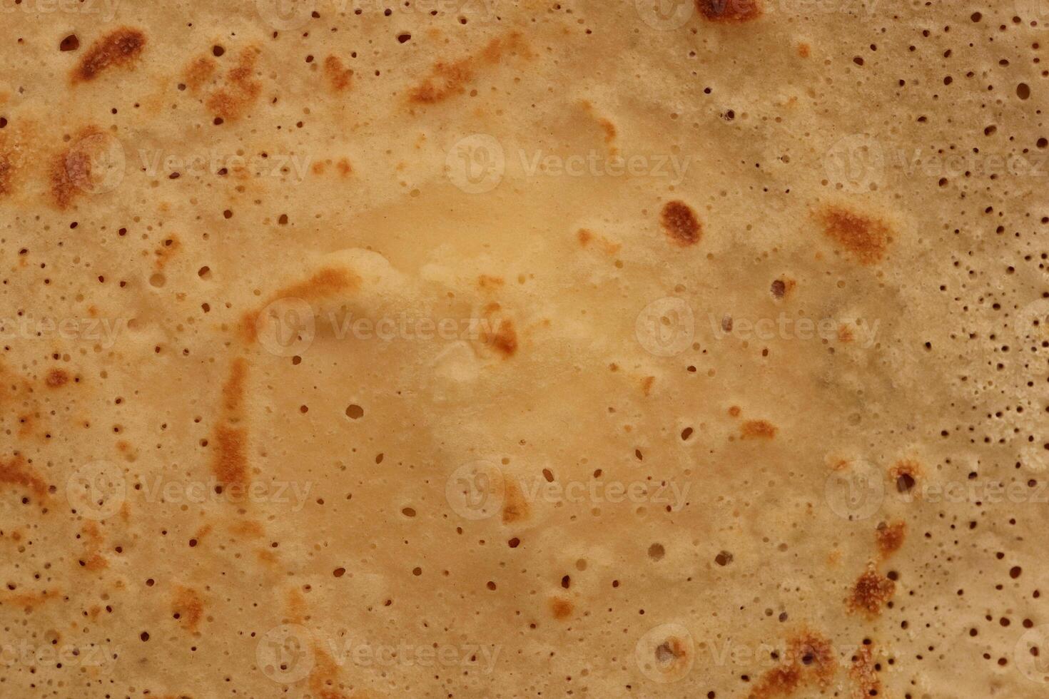 Toasted traditional desert pancake pattern texture. Macro closeup. photo