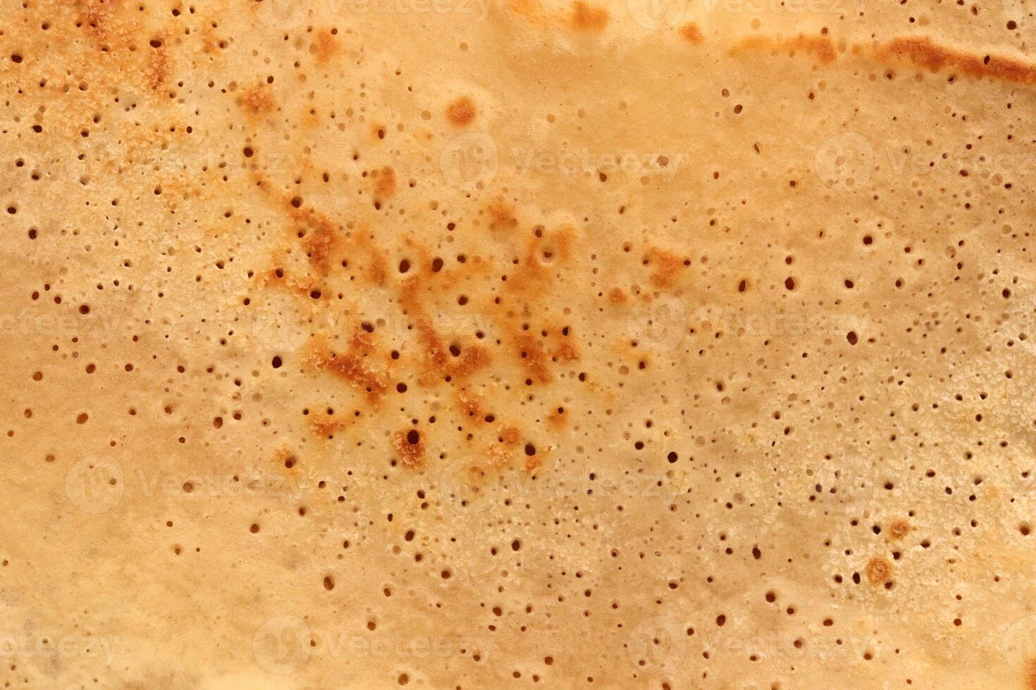 Toasted homemade pancake delicious backdrop texture. Macro closeup. photo
