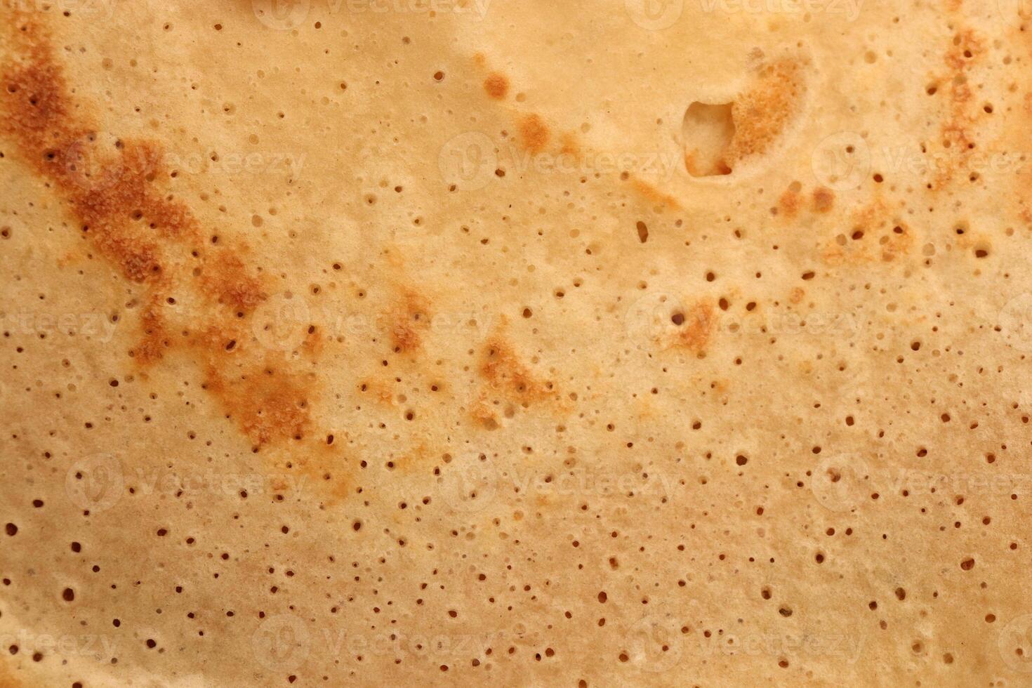 Light toasted tasty detail pancake background texture. Macro closeup. photo