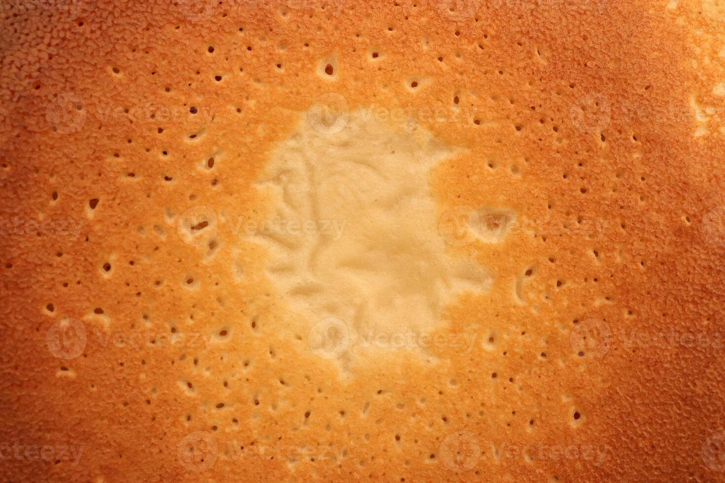 Backed sweet and warm pancake surface texture breakfast. Macro closeup. photo