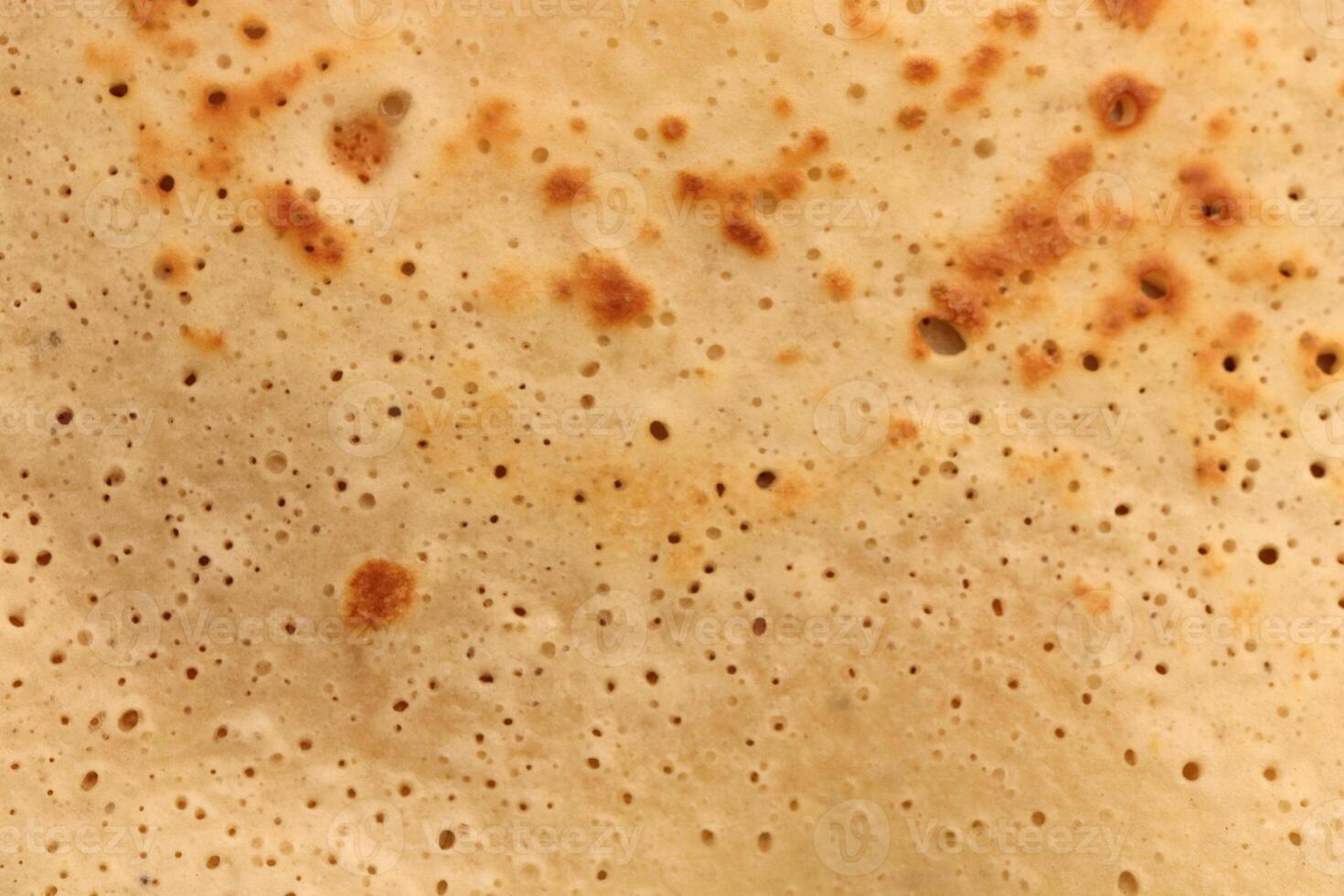 Toasted tasty detail pancake background texture. Macro closeup. photo