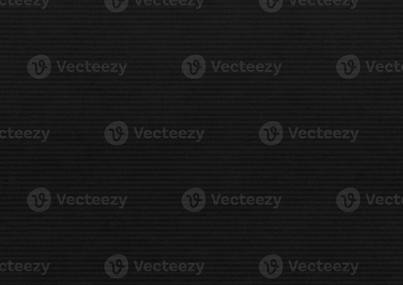 Black paper corrugated texture background. photo