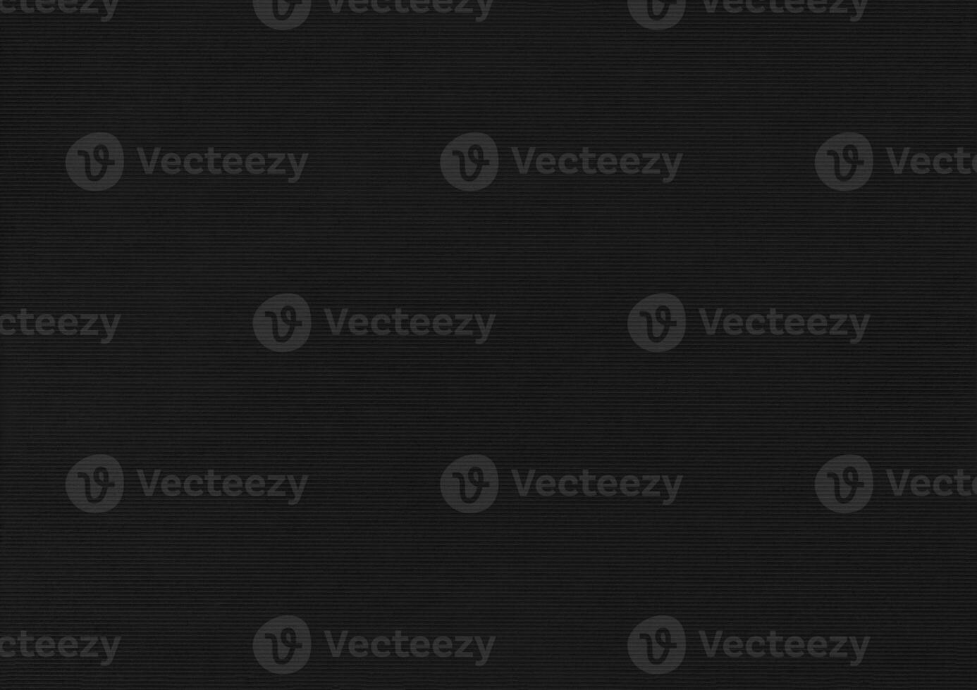 Black paper corrugated texture background. photo