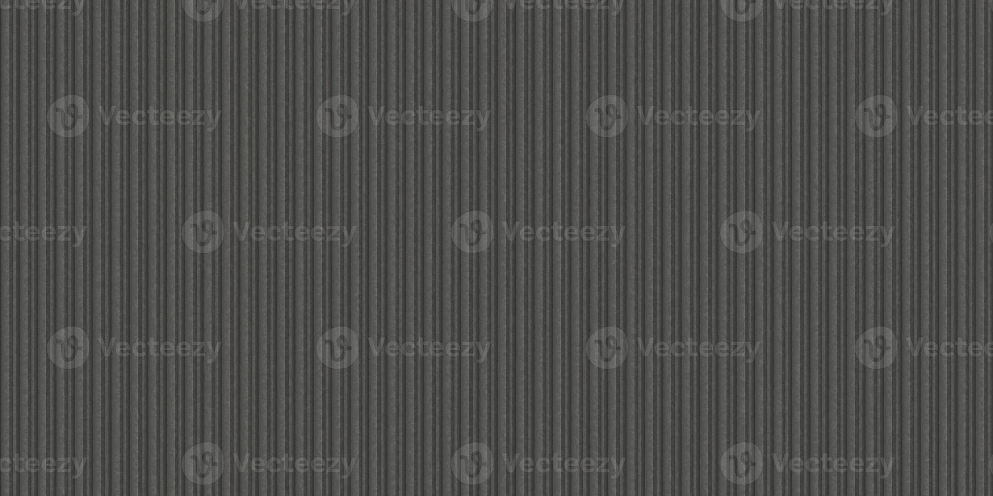 Dark gray corrugated metal texture. Crimp fence background. Ribbed metallic surface. Wavy iron wall pattern. Fluted metal fencing backdrop. photo