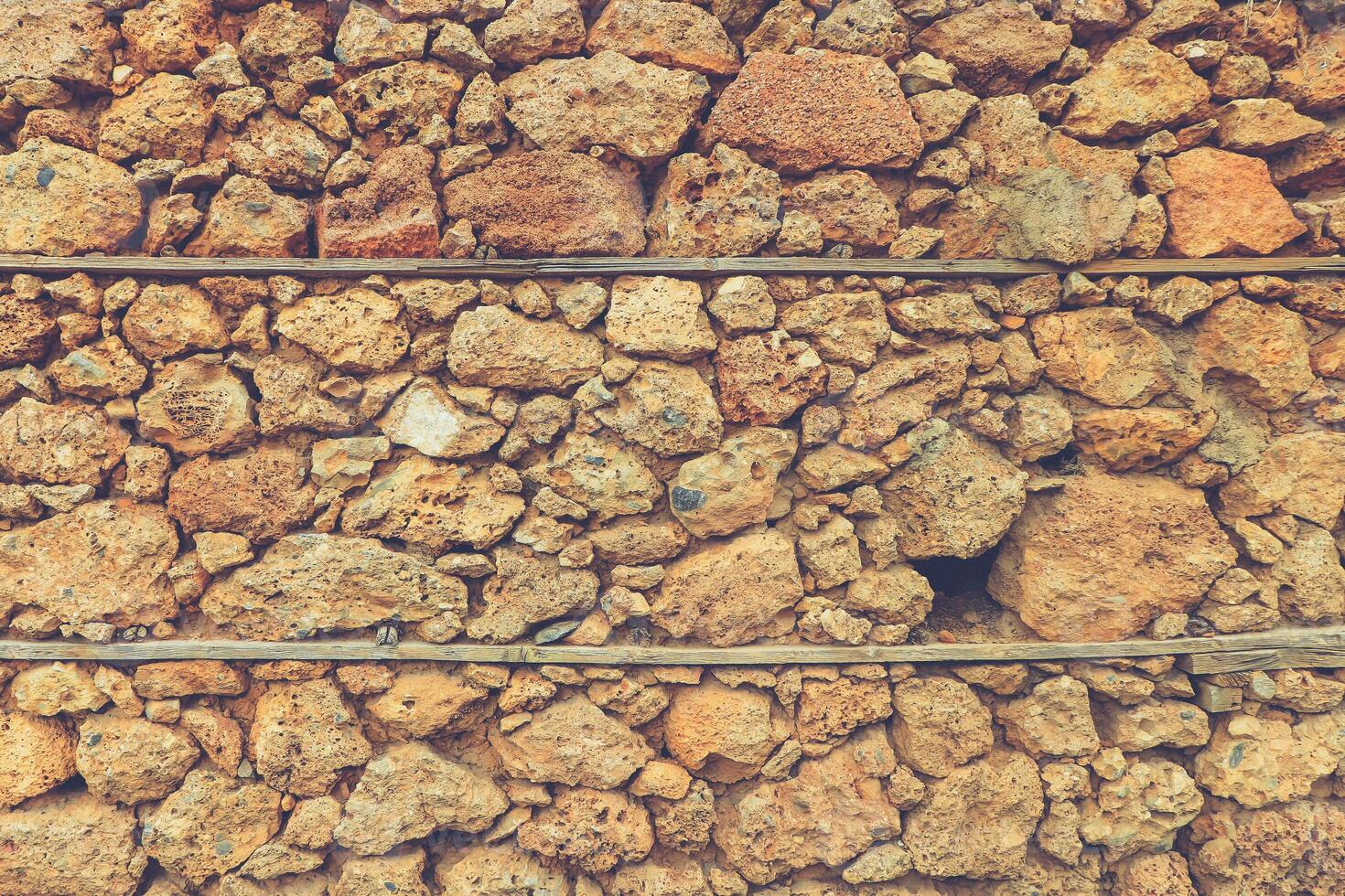 House of shell rock masonry cobblestones layers wall texture. Coquina surface background. photo