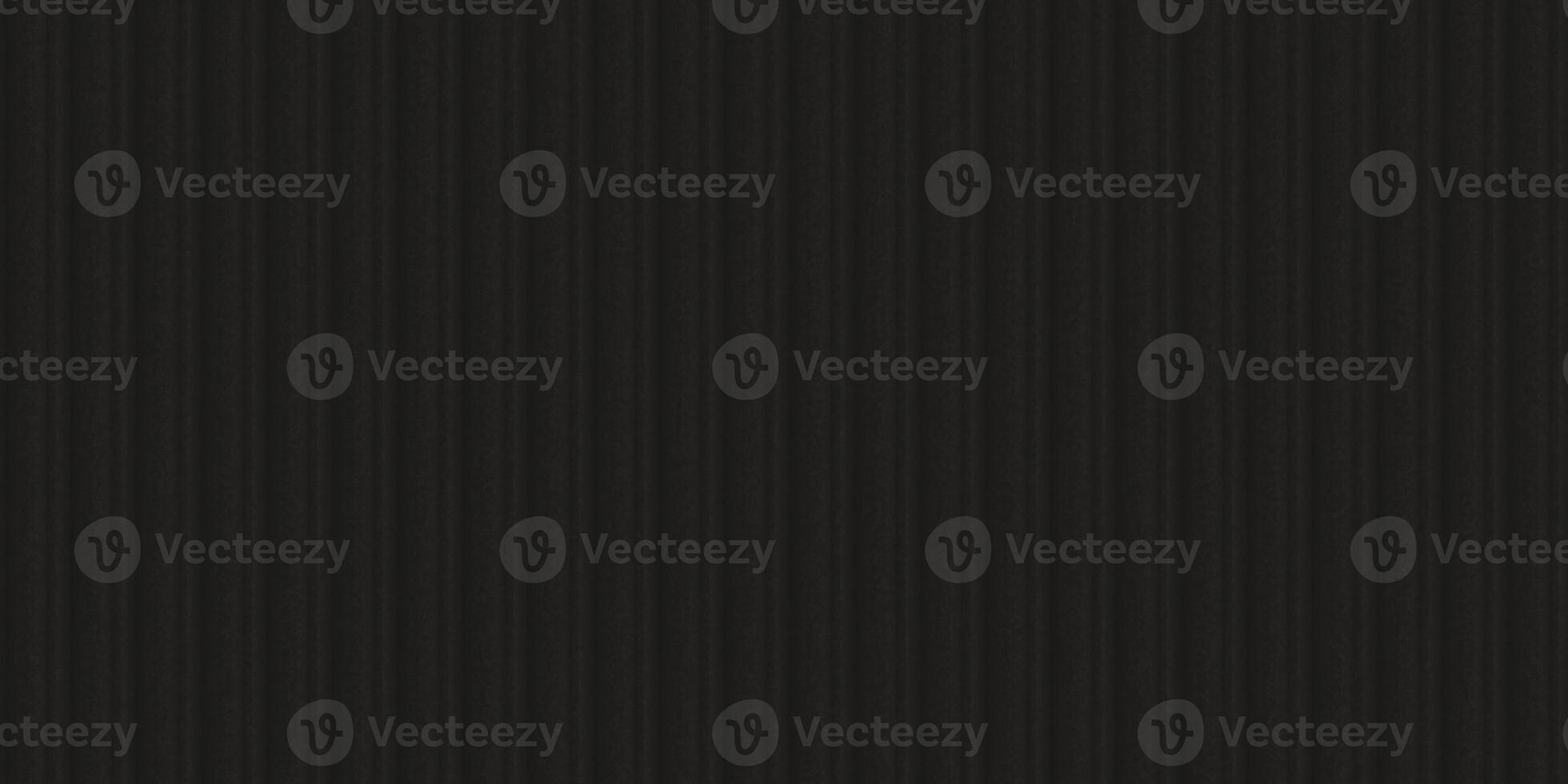 Black fluted metal fencing backdrop. Corrugated metal texture. Crimp fence background. Ribbed metallic surface. Wavy iron wall pattern. photo