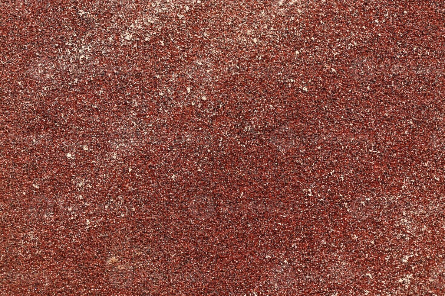 Red Sandpaper Texture. Rough Grit Abrasive Background. Used Grain Emery Backdrop. photo