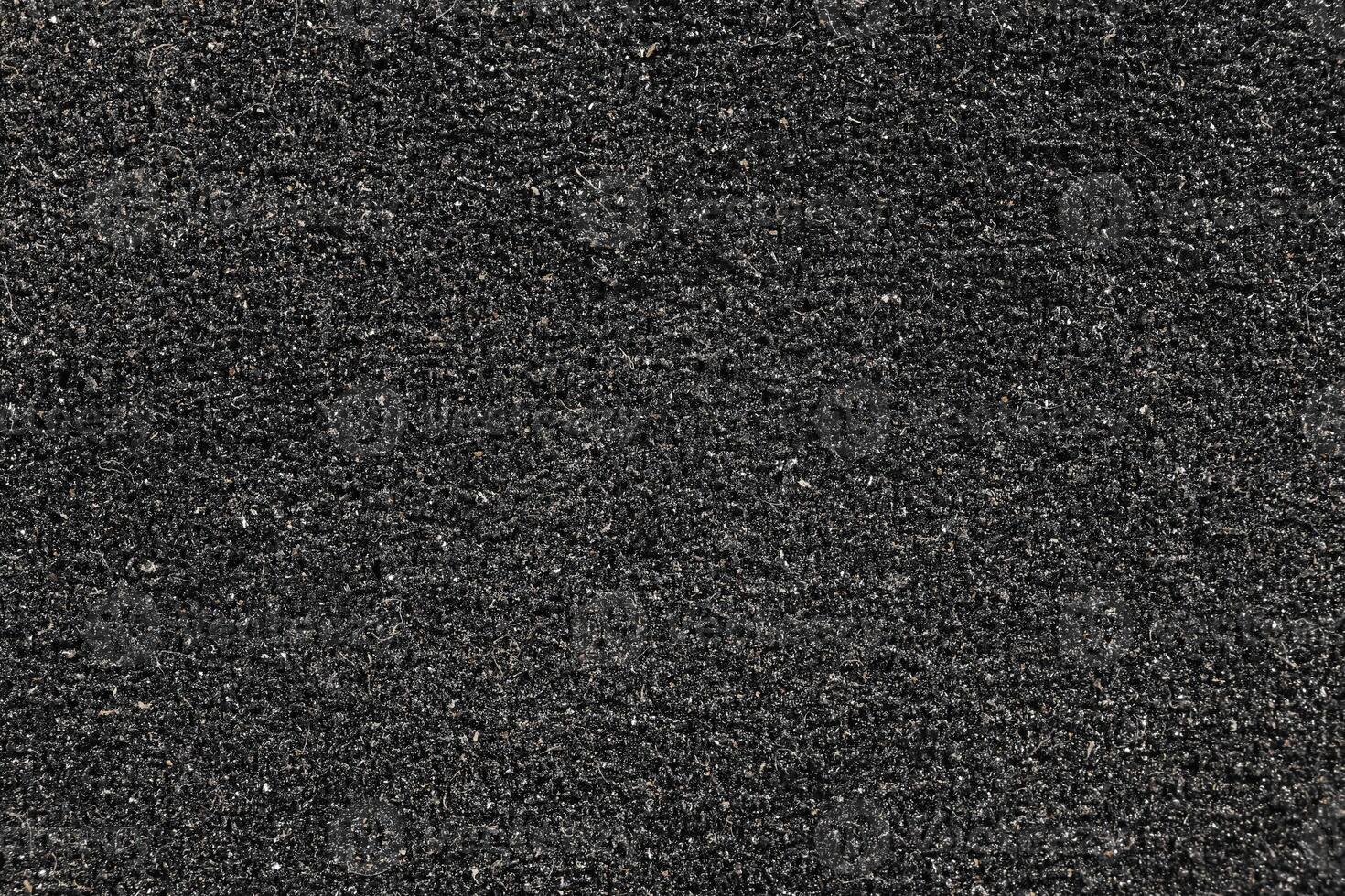 Black Sandpaper Texture. Blank Rough Grit Abrasive Background. Clear Grain Emery Backdrop. photo