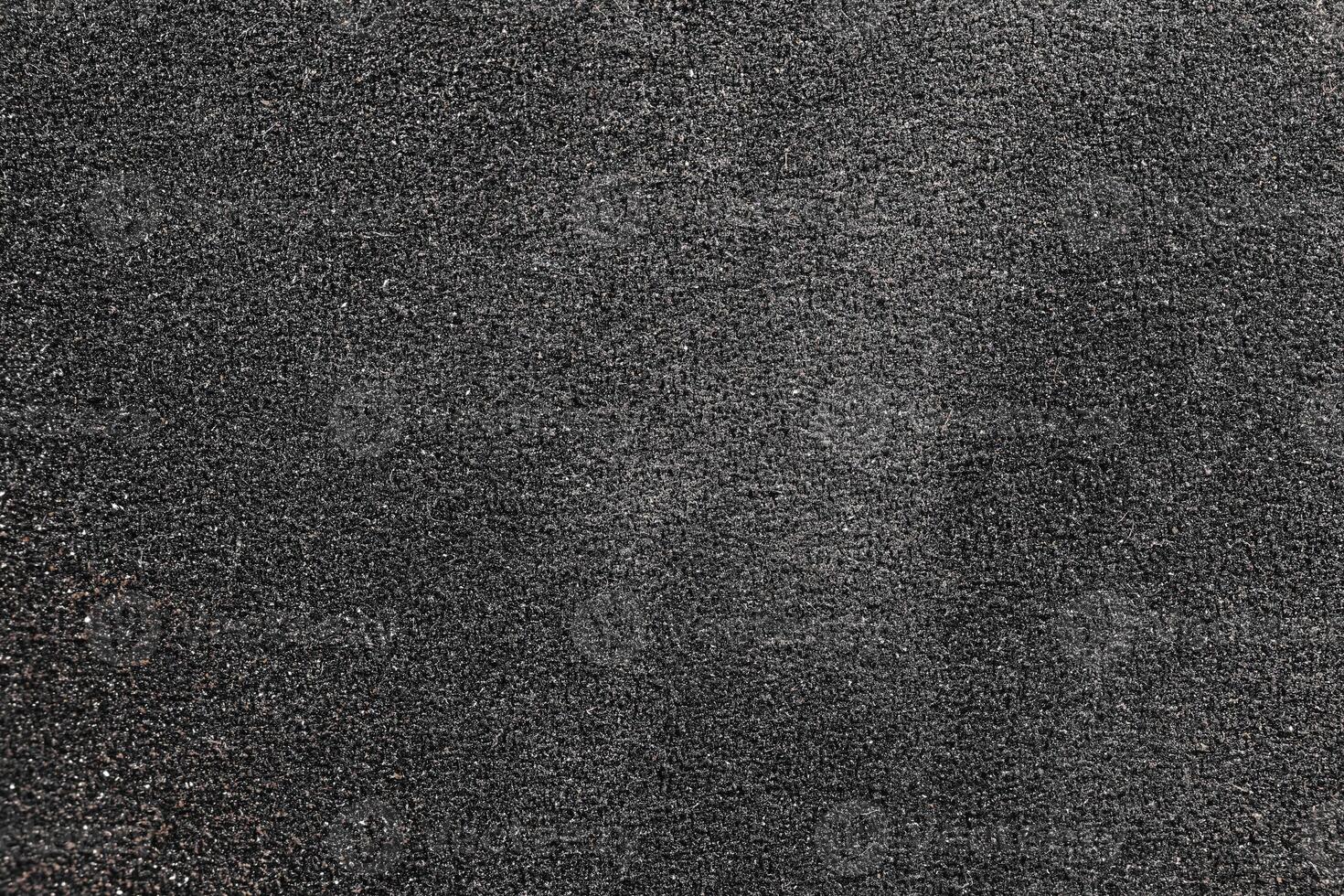 Black Sandpaper Texture. Rough Grit Abrasive Background. Grain Emery Backdrop. photo