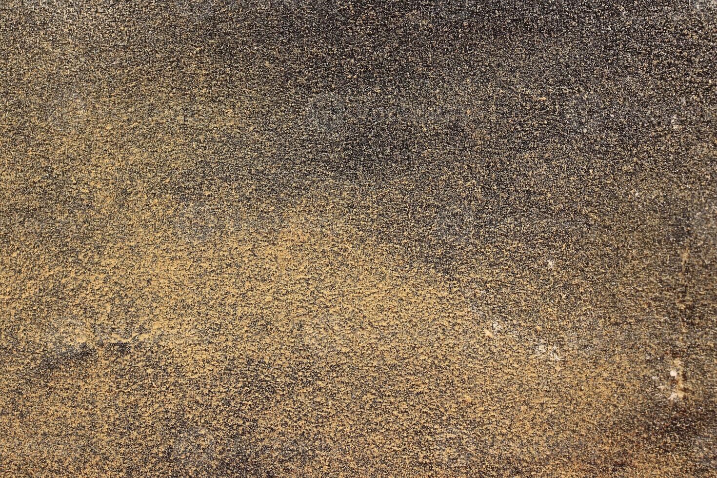 Black Yellow Sandpaper Texture. Rough Grit Abrasive Background. Used Grain Emery Backdrop. photo