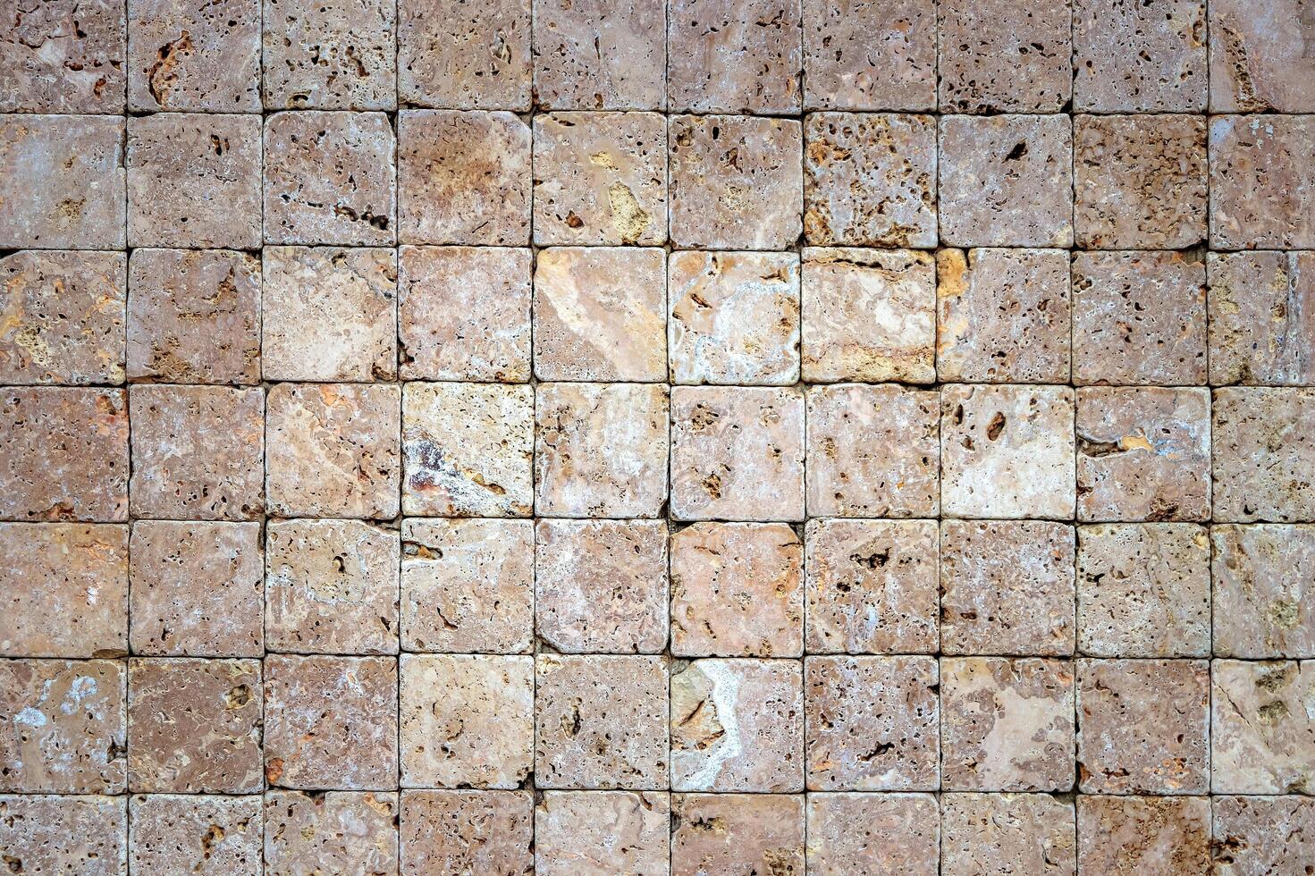 Travertine masonry tiles cladding wall texture. Square stones surface background. photo