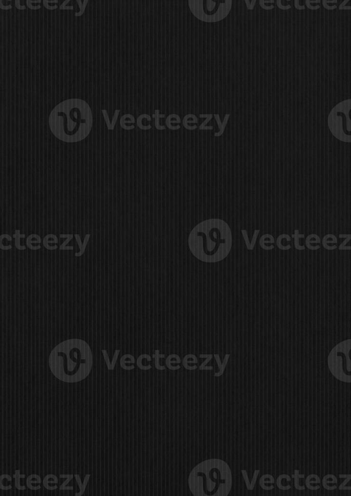 Ridged black paper corrugated texture background. photo