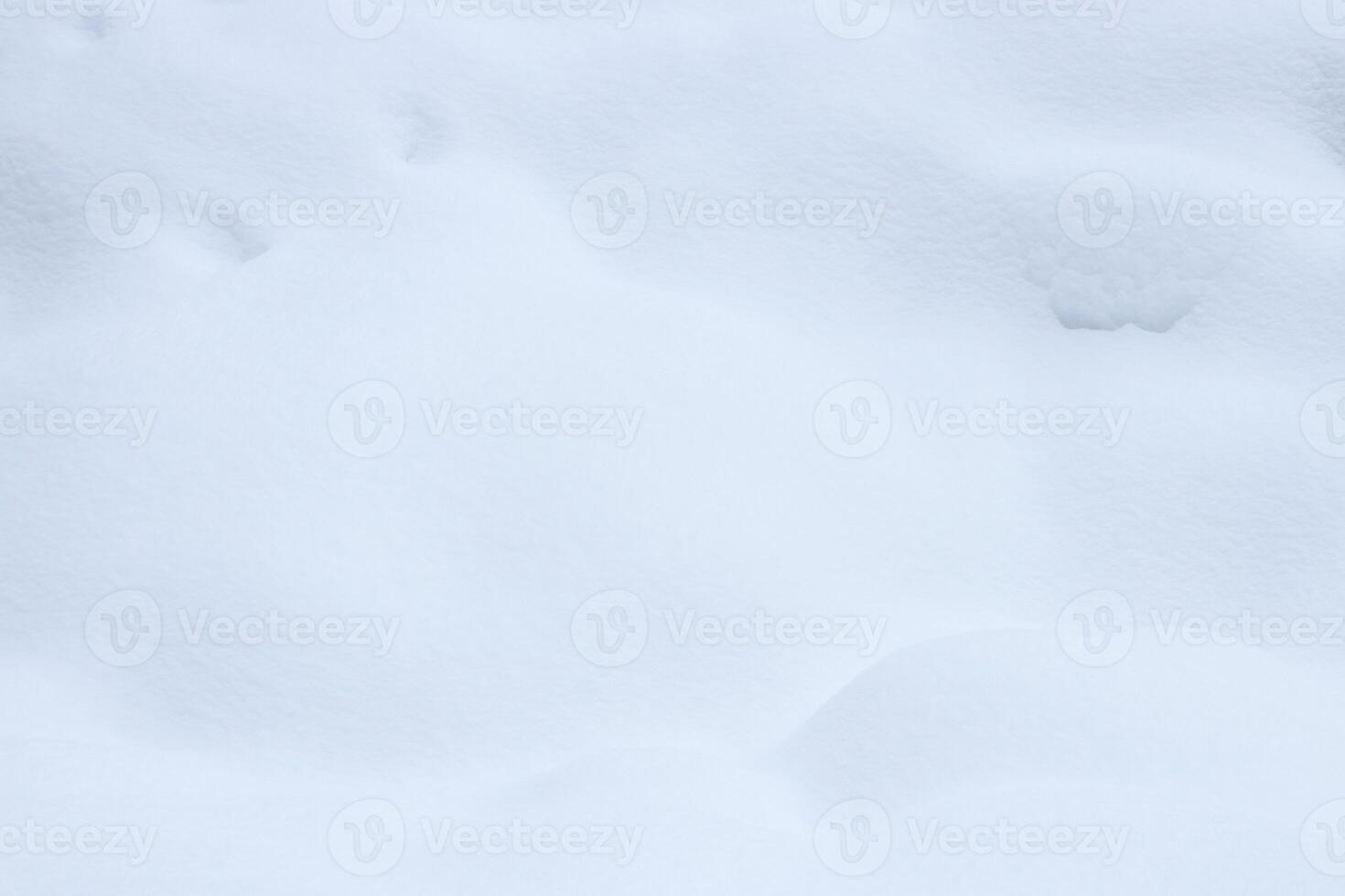 Snowy mound texture. Winter snowdrift landscape background. Soft snow hills surface. photo