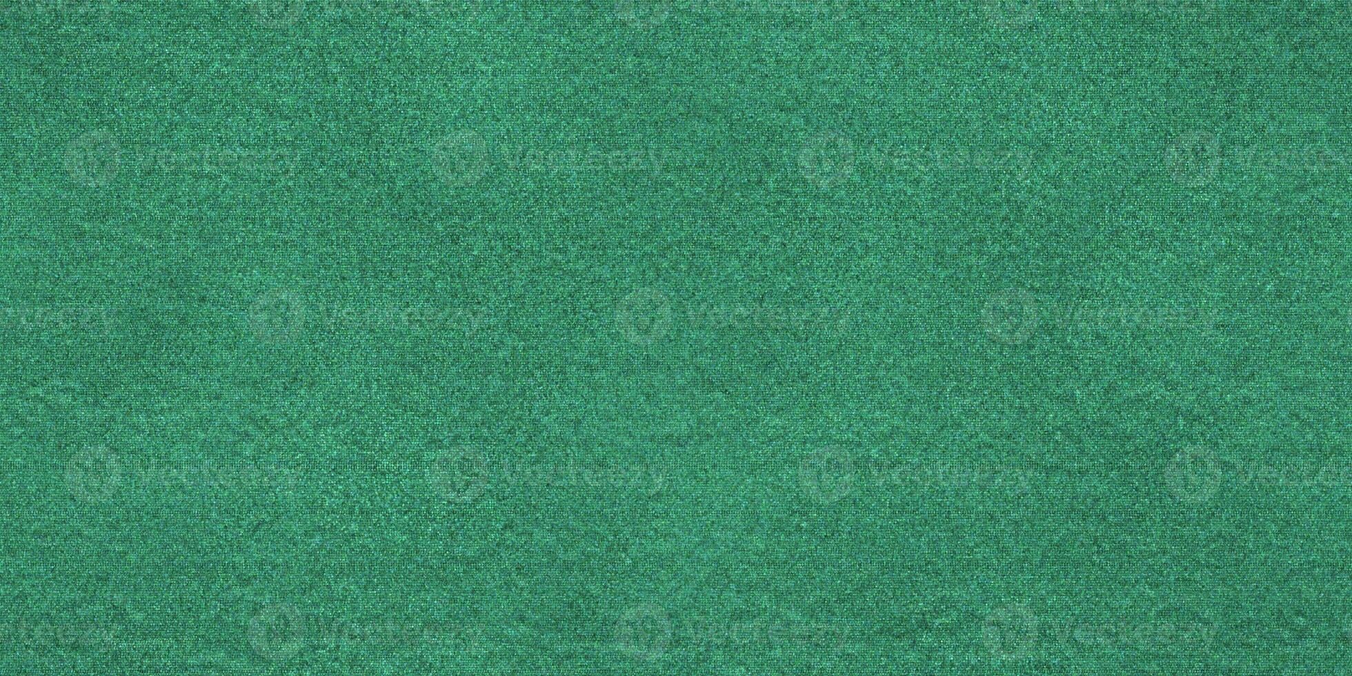 Green cut pile saxony carpet texture. Flat seamless background. Floor rug fabric textile. photo
