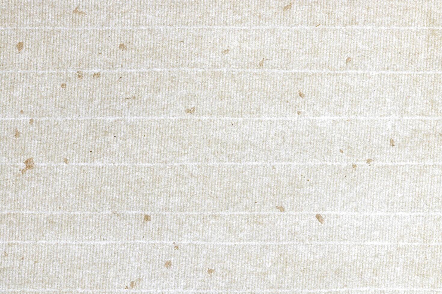 Gold spots decorated paper with stripes background. Decorative cream striped paper texture. Landscape horizontal orientation. photo