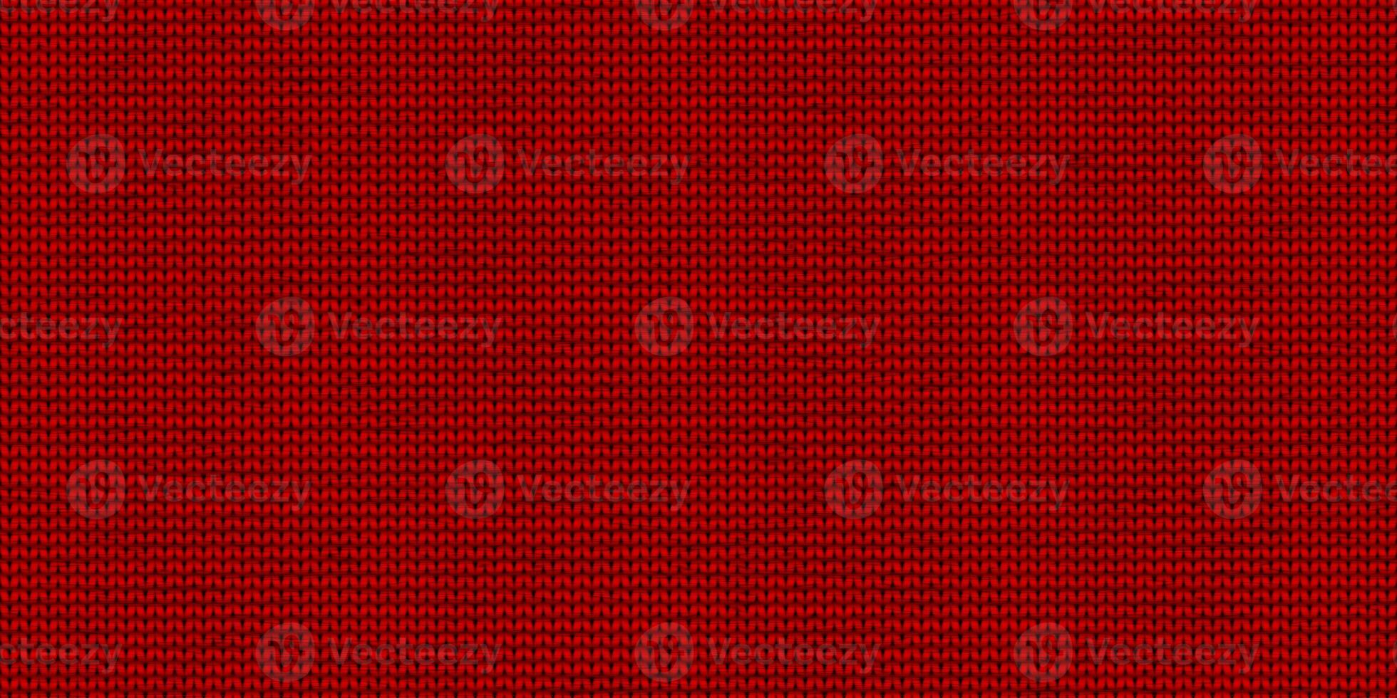 Red knitwear material backdrop. Knitting wear textile background. Seamless knit texture. Knitted clothes fabric surface pattern. photo