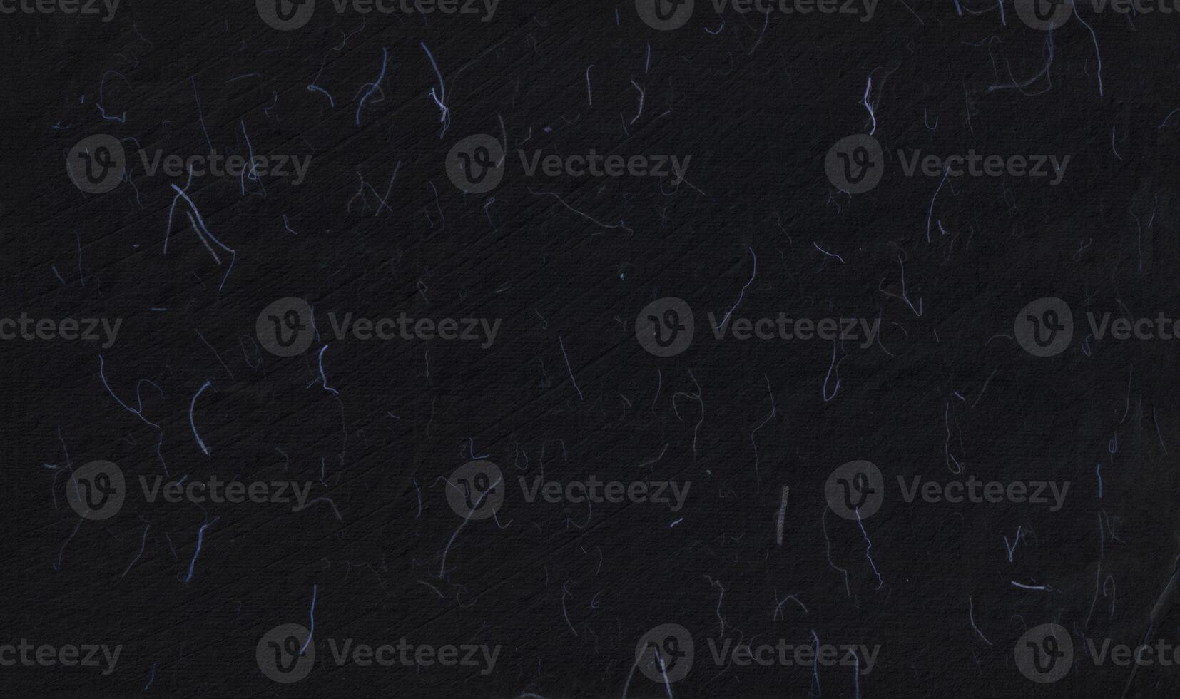 Handmade rice black paper texture with blue fibers for scrapbook. photo